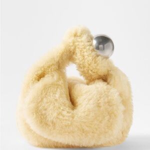 JIL SANDER

Sphere-Handle Shearling Clutch